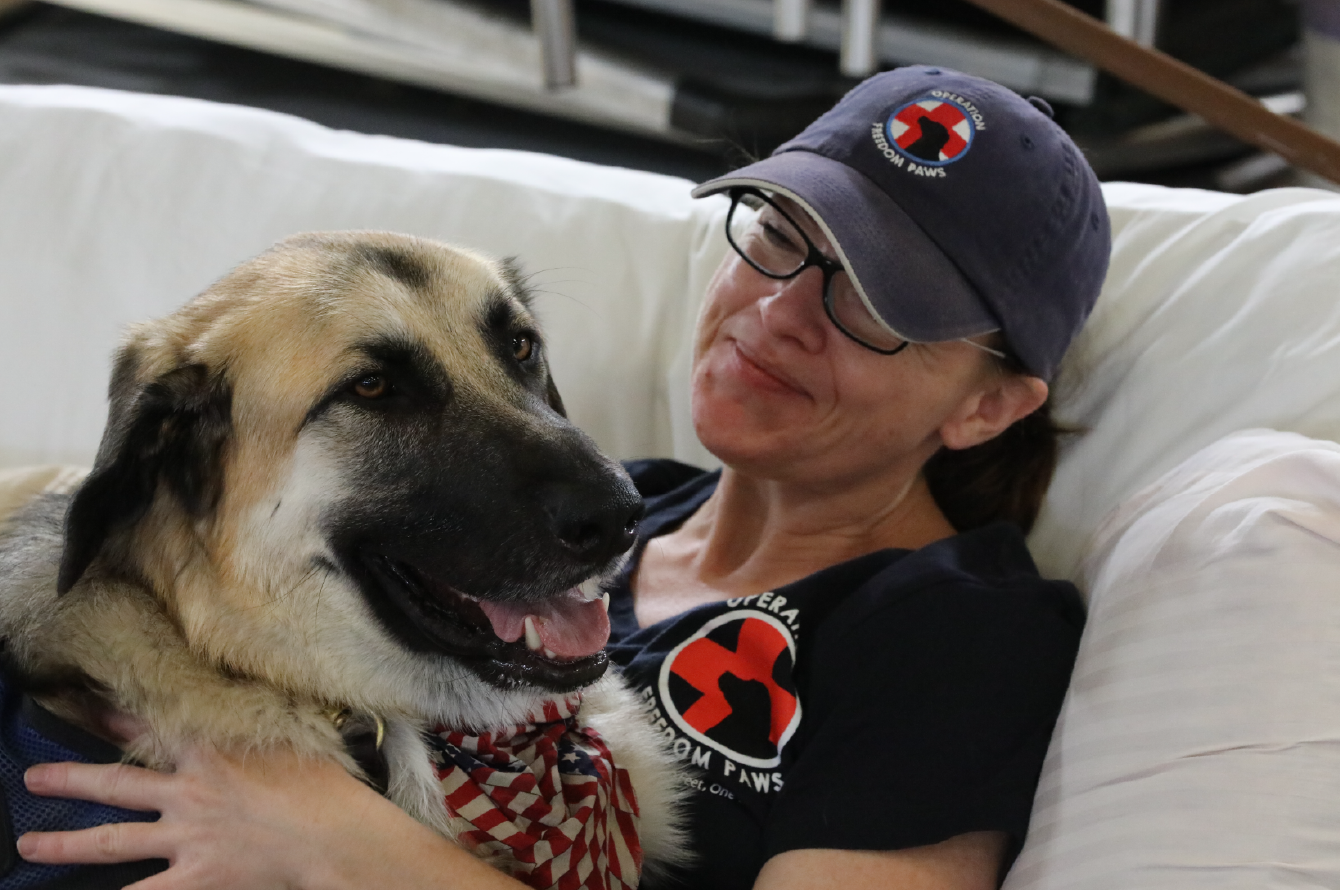 Woman with her service dog. Team stories